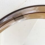 Space age round mirror with a smoked acrylic border