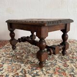 Low stool in carved wood