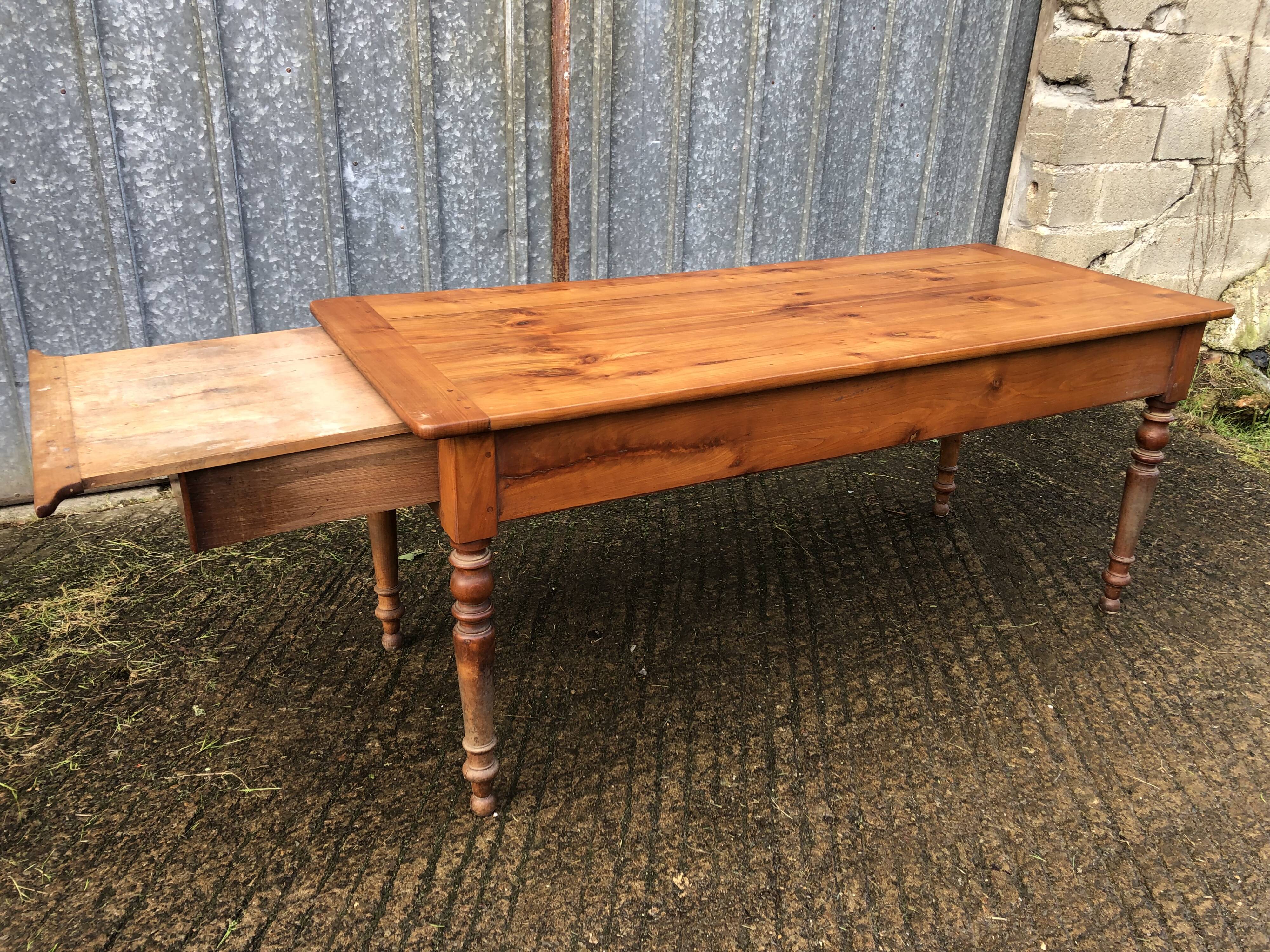 Antique farmhouse table in solid cherry wood in Louis Philippe style.