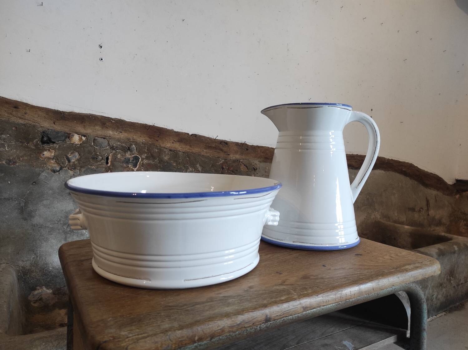 Large pitcher and enameled basin.