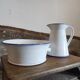 Large pitcher and enameled basin.