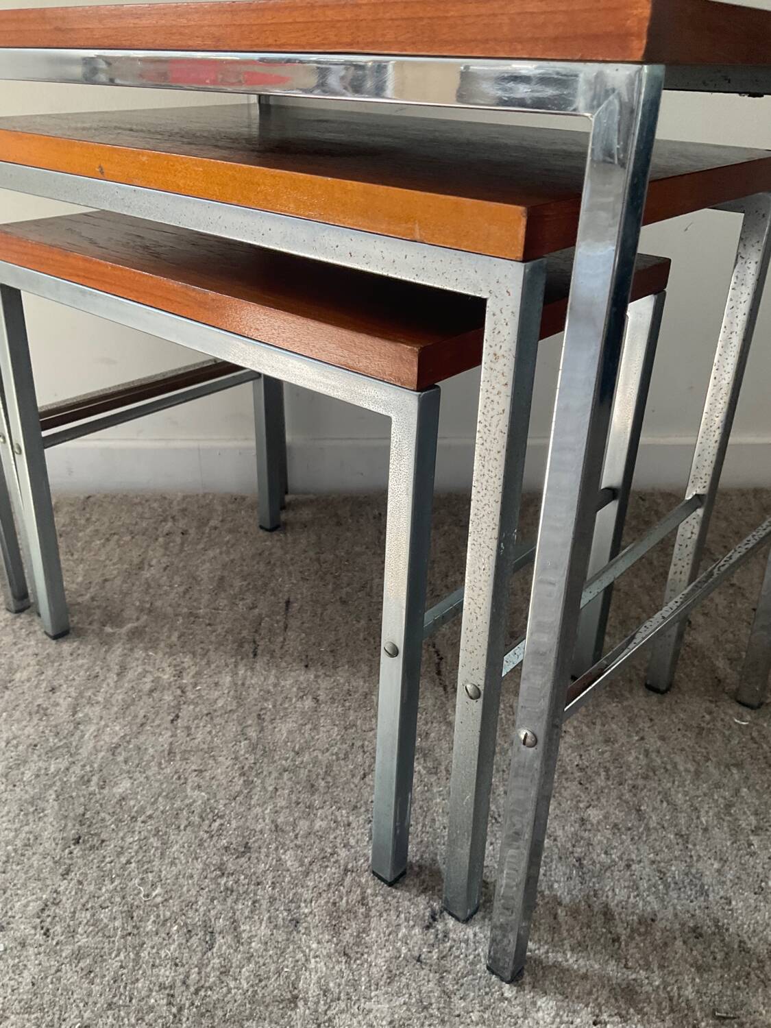 Trio of teak and chrome metal nesting tables from the 60s-70s