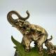 Art Deco bookends with elephants in brass and marble.