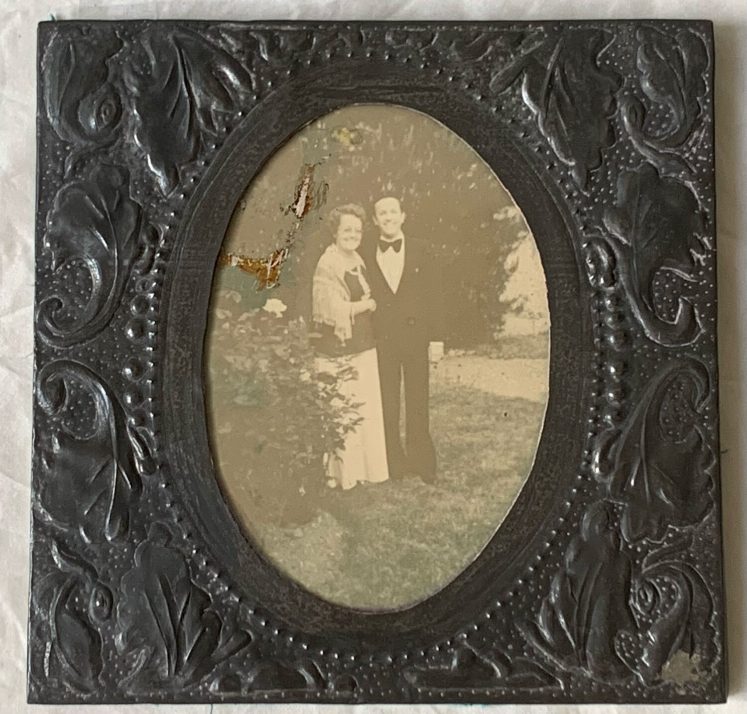 Old photo holder frame in vintage chiseled pewter