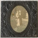 Old photo holder frame in vintage chiseled pewter