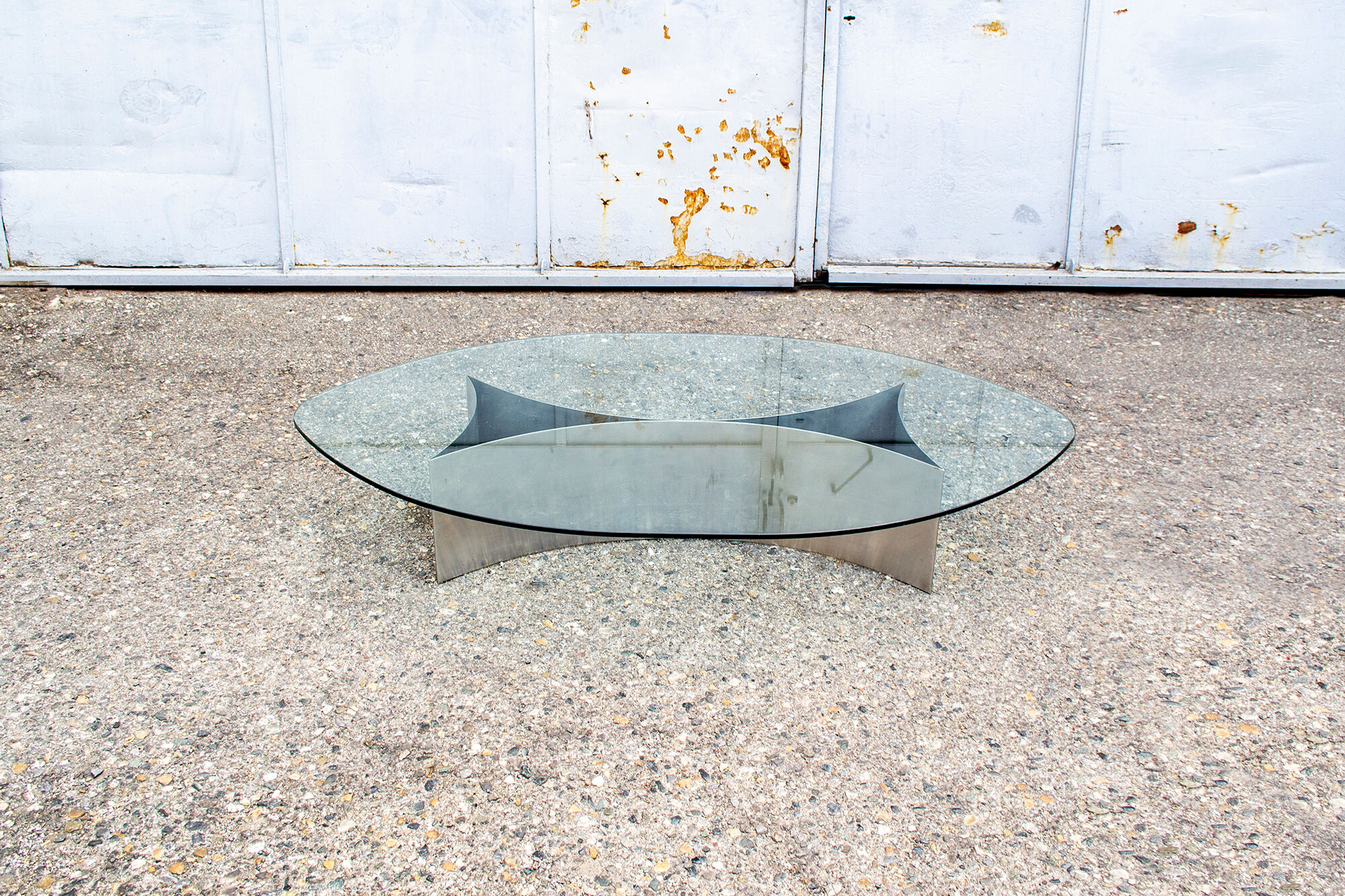 Brutalist coffee table with steel base and 70s glass top