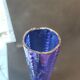 Vintage cobalt blue glass vase with foliage decoration.