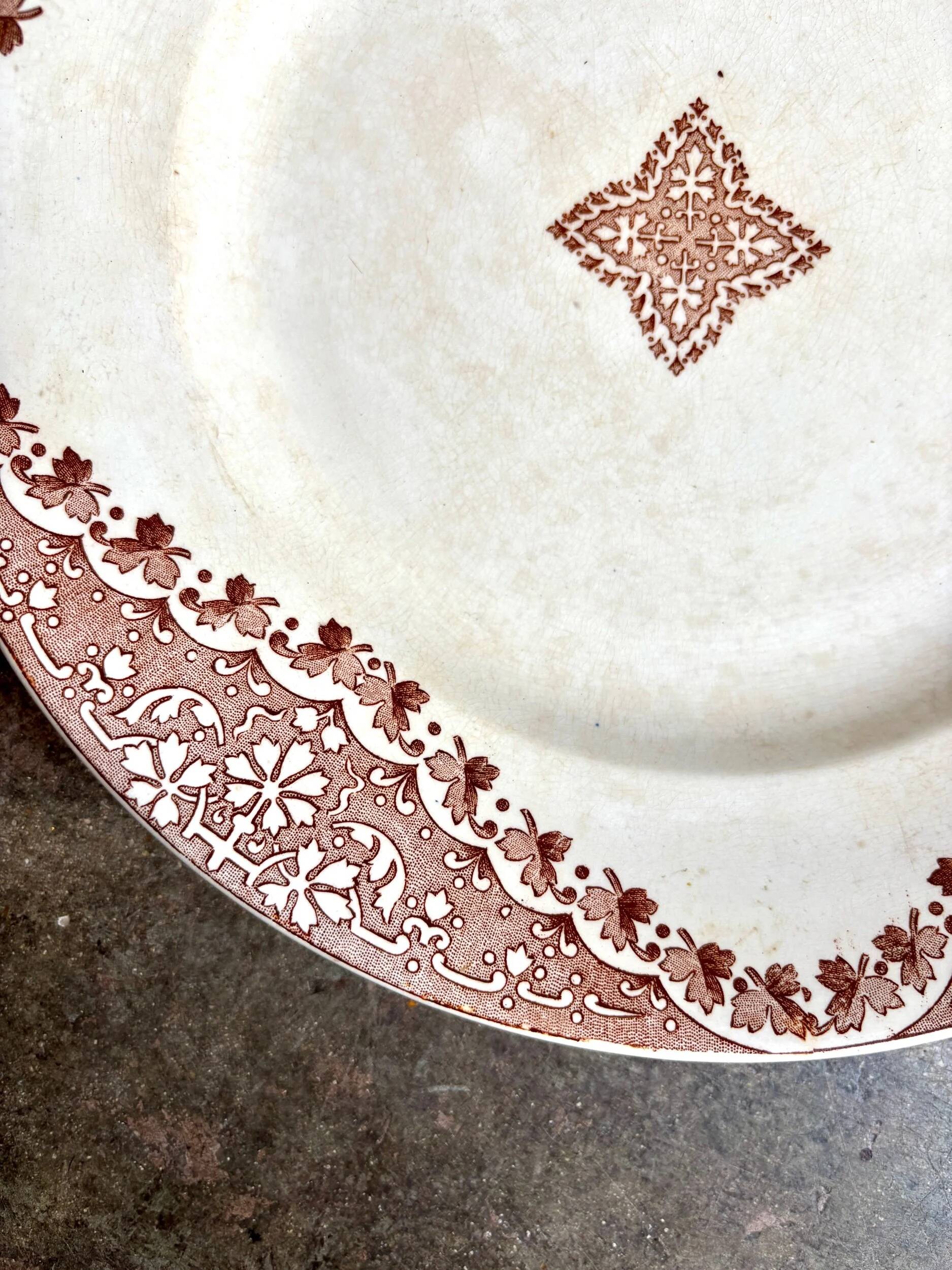 Longwy round dish in brown ironstone, "Andalous" service