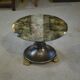 Neo-classical cast iron and glass eglomisé coffee table from the 1940s.