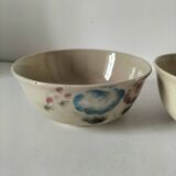 Two large vintage bowls in pastel decor on mini pedestals.