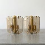 Pair of brass and smoked glass wall lights