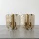 Pair of brass and smoked glass wall lights