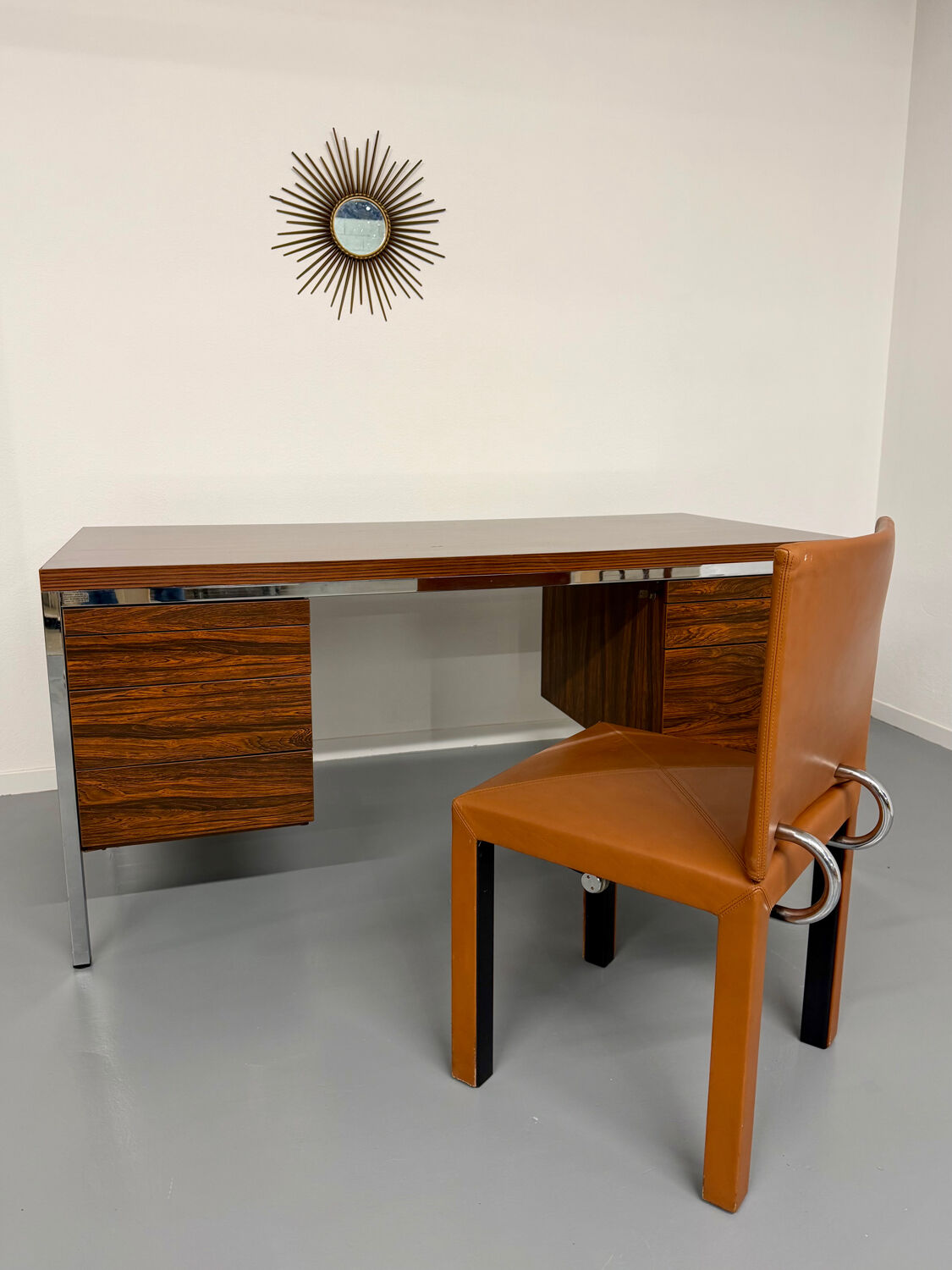 Vintage desk with rosewood veneer and chrome metal design from the 1970s.