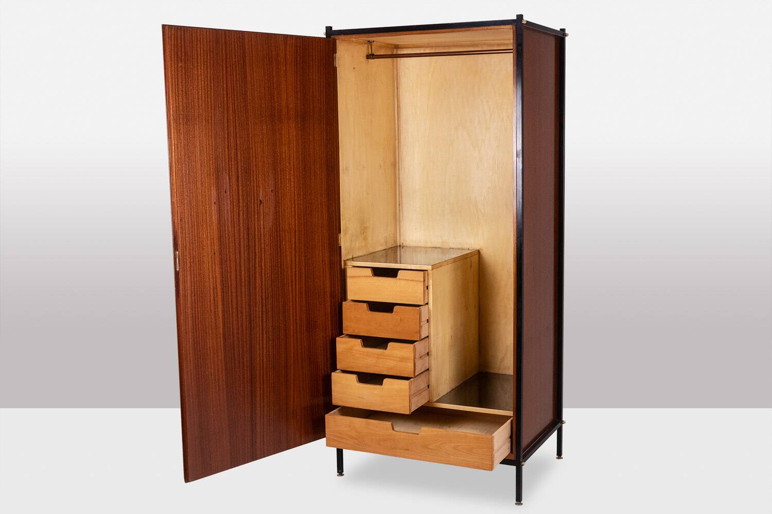 Pair of mahogany veneer and black lacquered iron cabinets. 1950s.