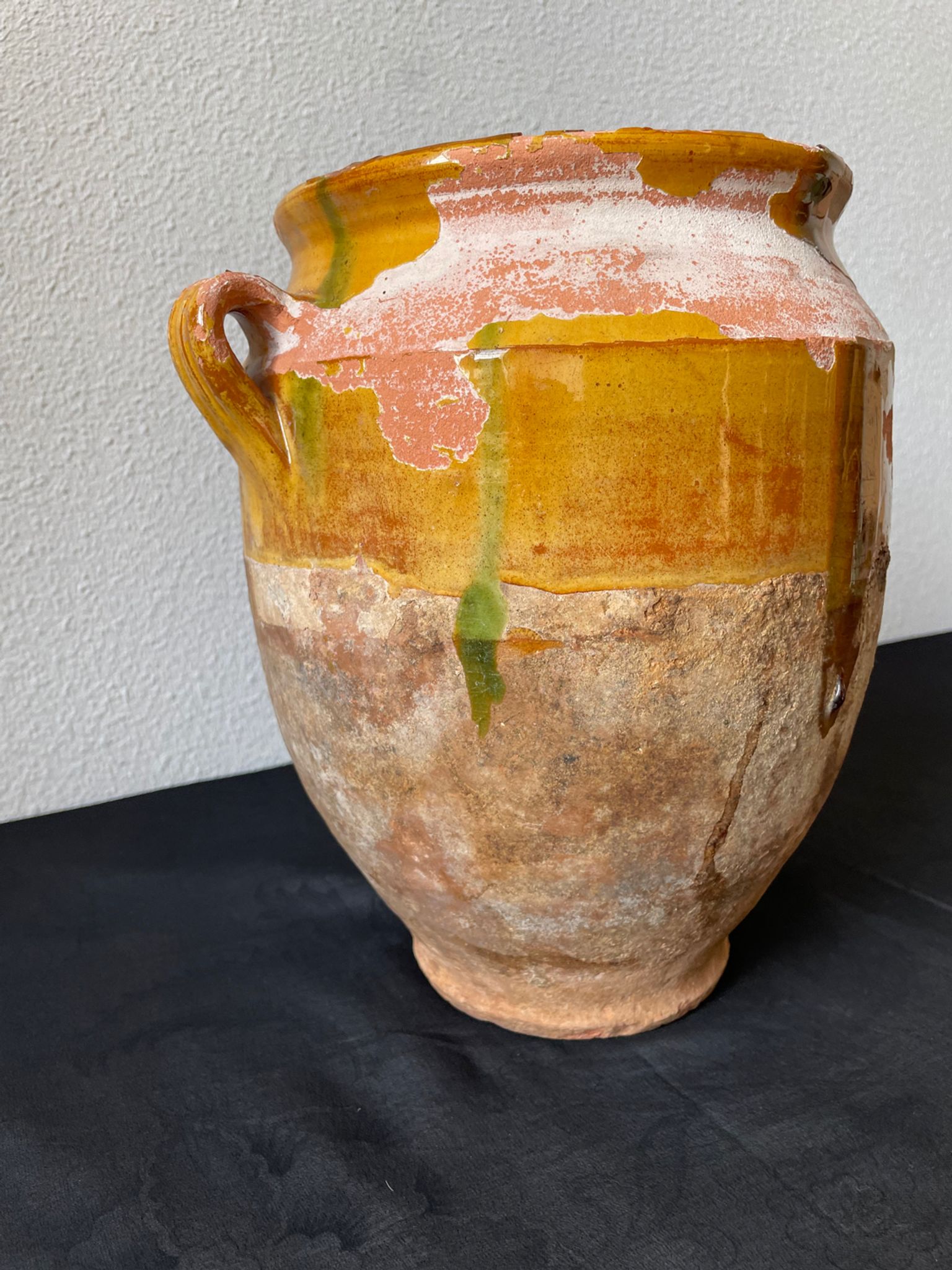 Old grease pot in glazed yellow terracotta, France nineteenth century