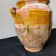 Old grease pot in glazed yellow terracotta, France nineteenth century