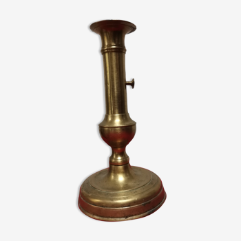 Candle holder with push button