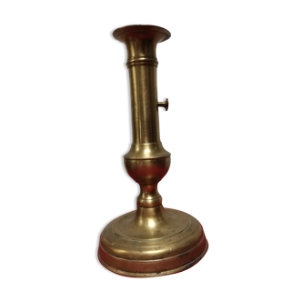 Candle holder with push button
