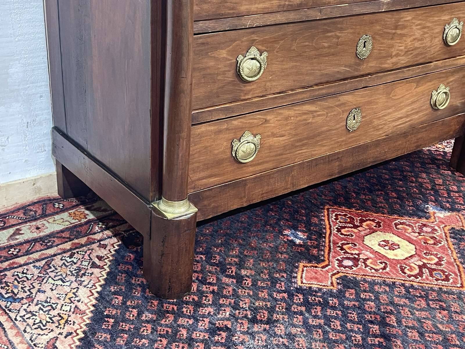 19th century Empire chest of drawers in cherry wood and black marble