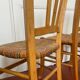 Trio of vintage straw/colored chairs