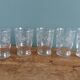 Old digestif or liqueur glasses, handcrafted glass with a floral pattern.