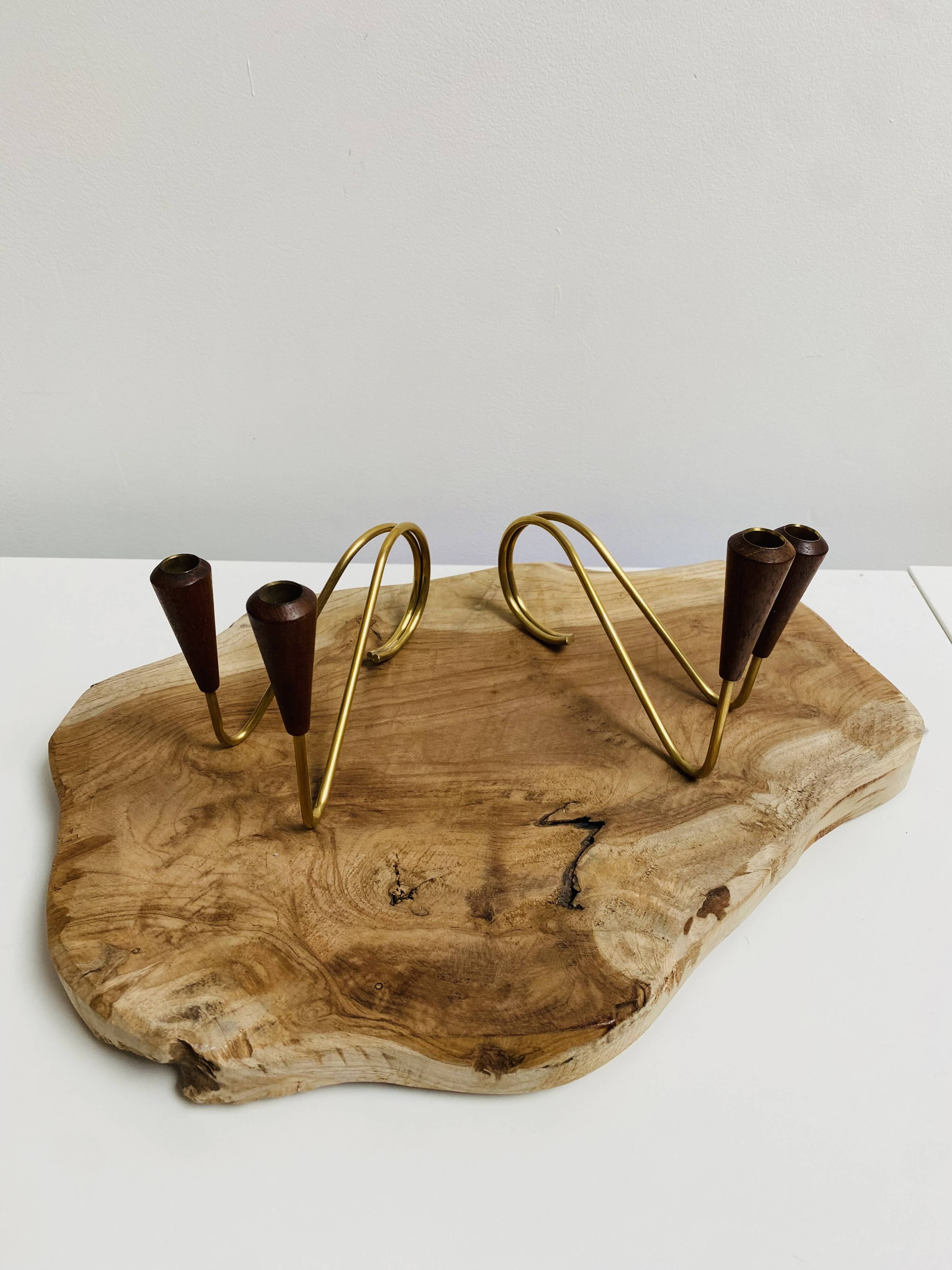 Pair of teak and brass candlesticks