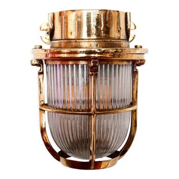 Old bronze wall lamp with wide streaked glass