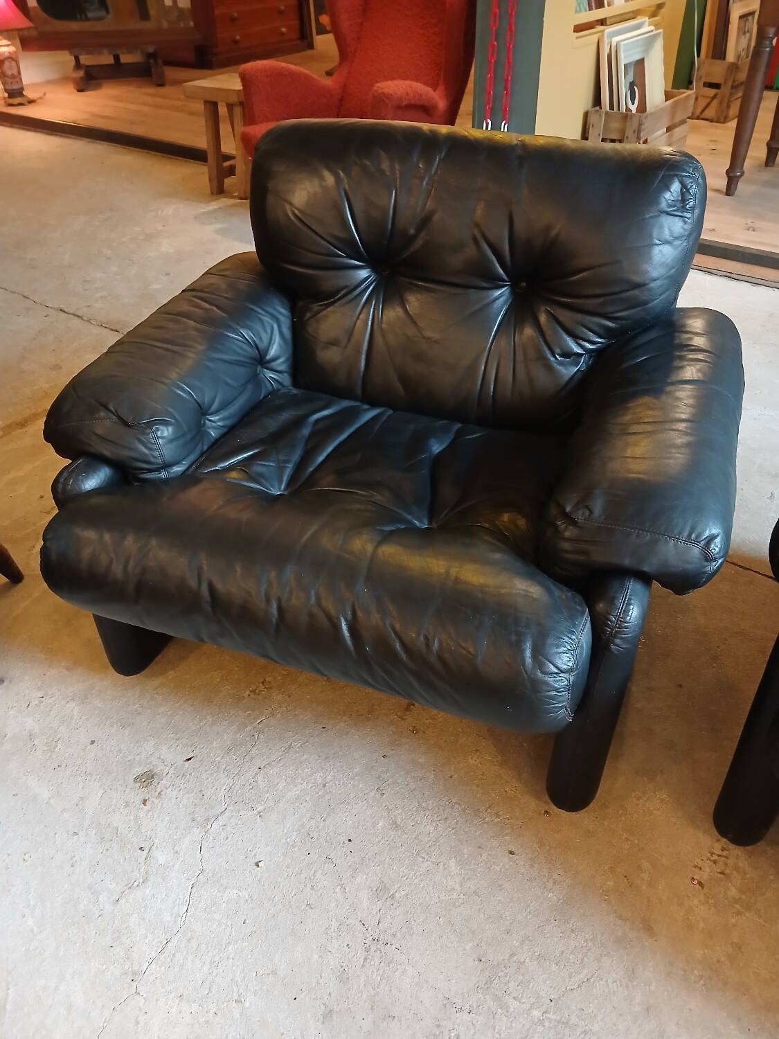 Pair of designer leather armchairs by Tobia Scarpa