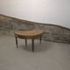 Half-moon extendable oak table for 2 to 8 people.