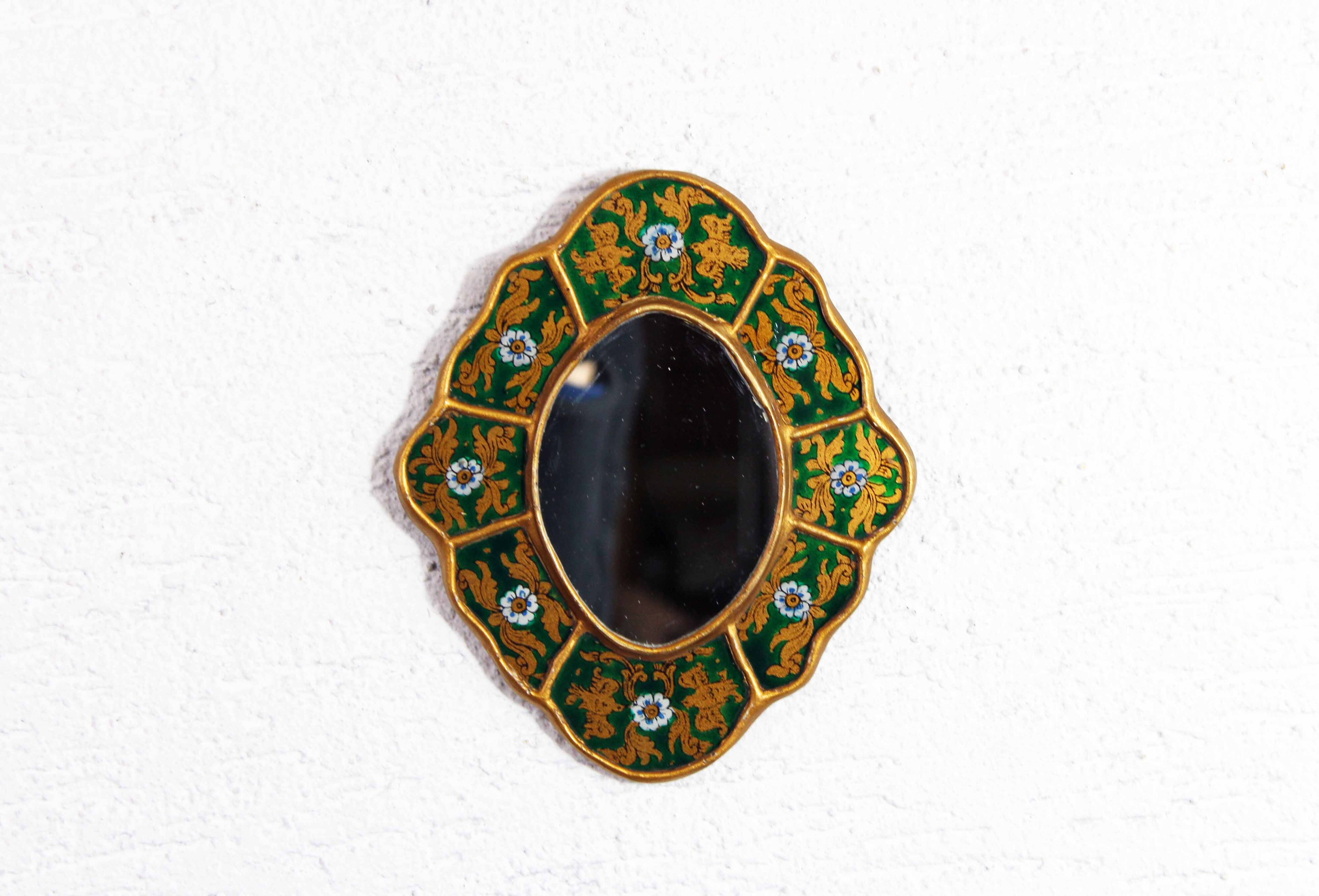 Golden mirror with decor