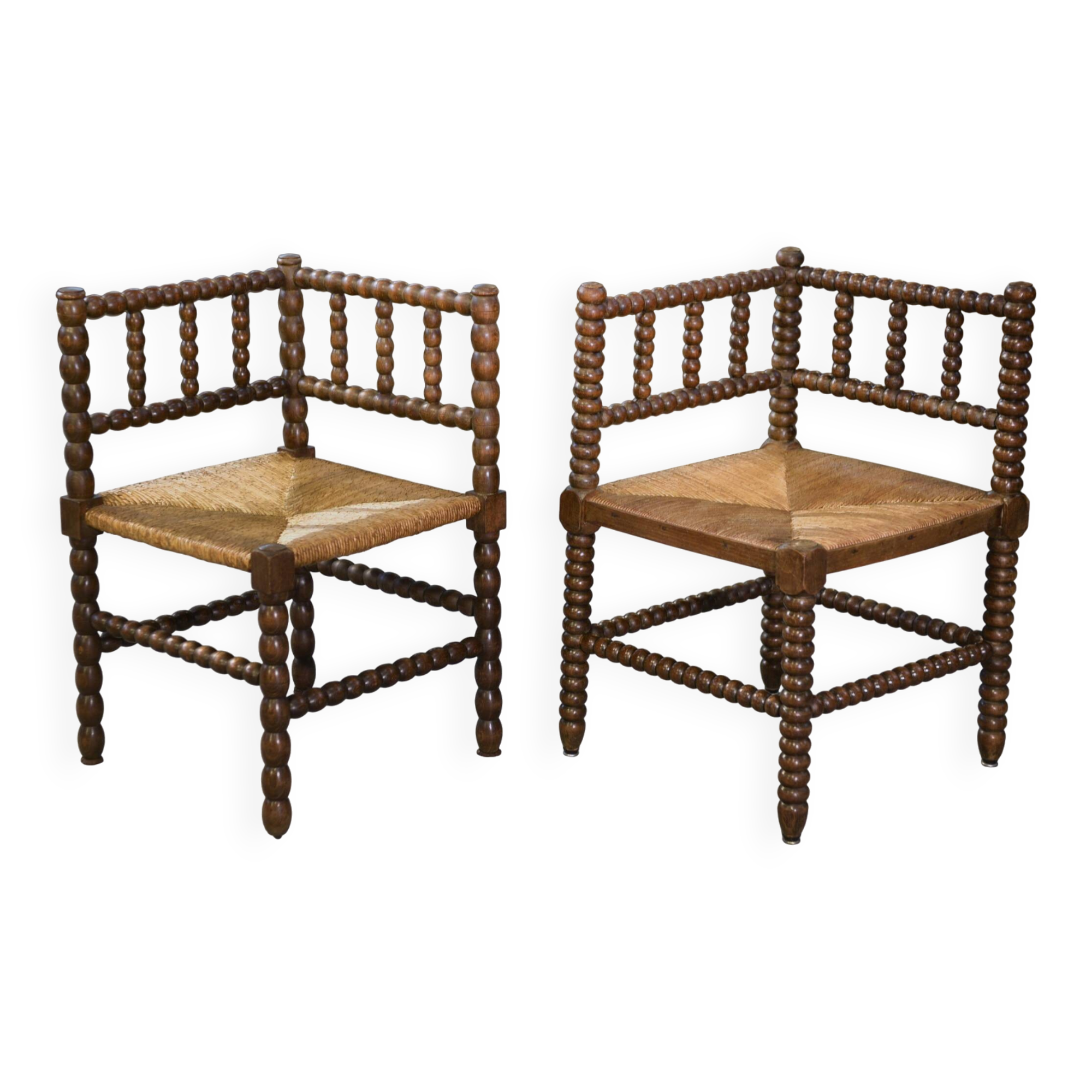 Pair of turned wooden corner chairs from the 1950s.