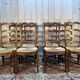 Set of 8 rustic high-back straw chairs.