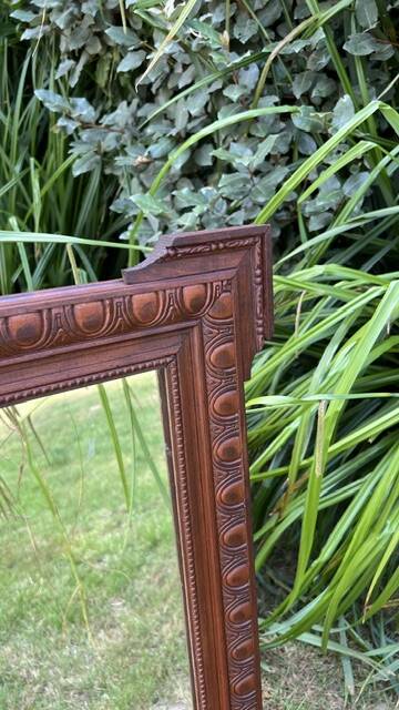 Antique carved wooden mirror