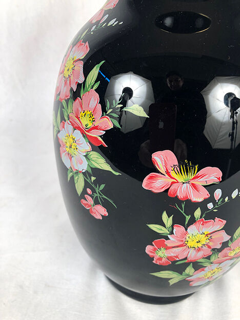 Black opal vase decorated with flowers