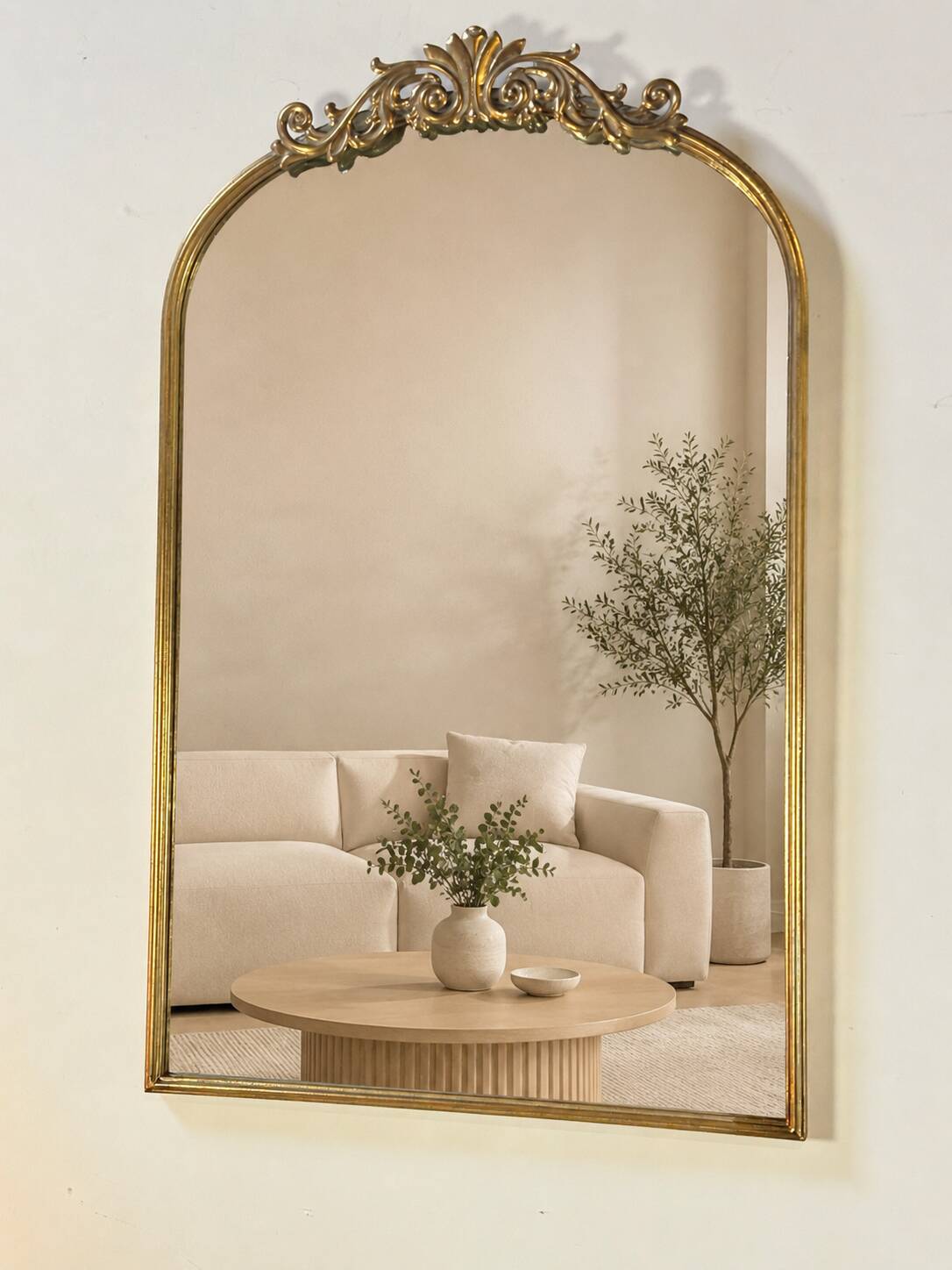 Golden metal pediment mirror from the 2000s.