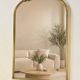 Golden metal pediment mirror from the 2000s.