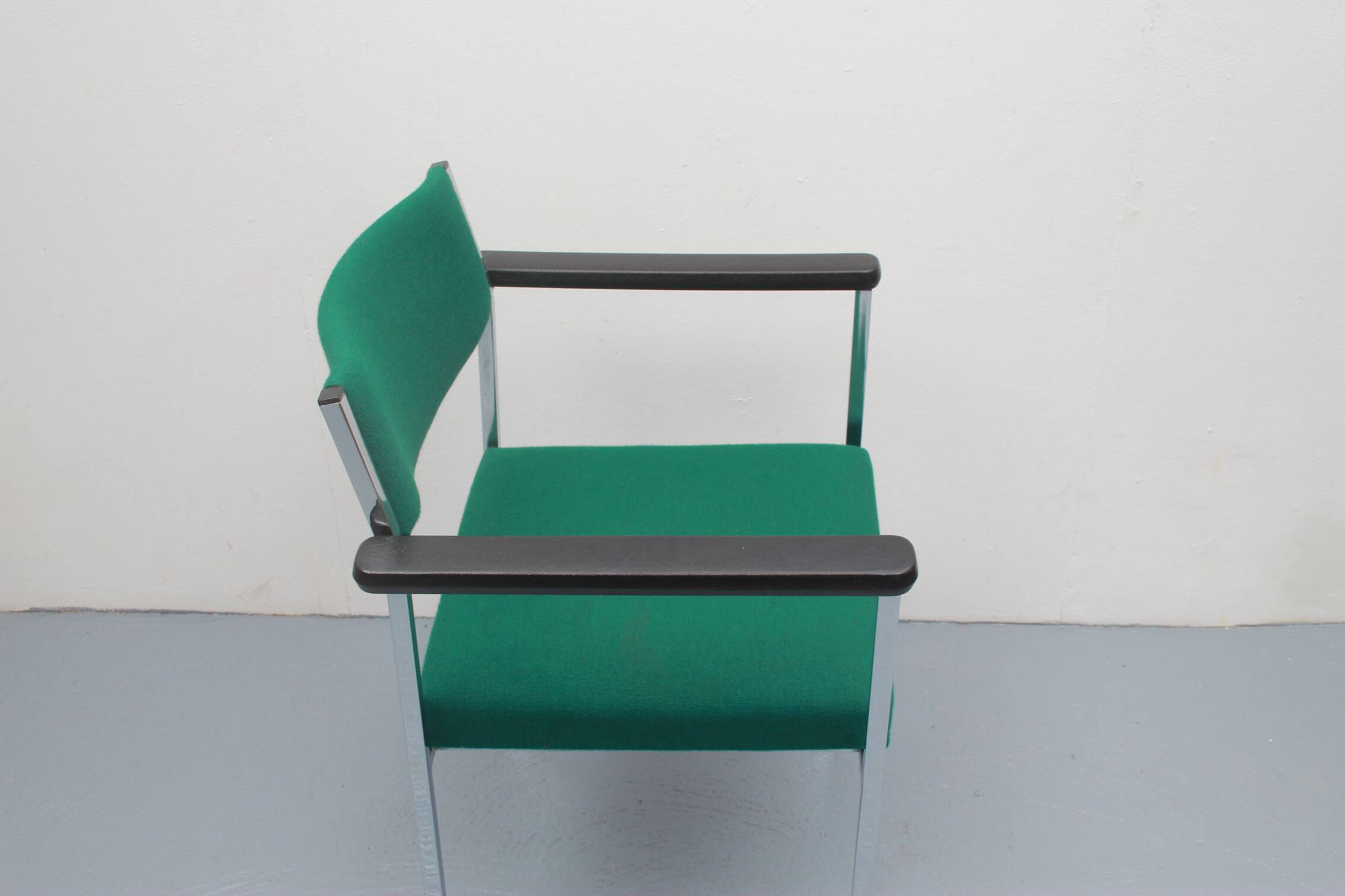 1970s chair in green with armrests