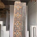 Indonesian construction element in carved wood with cross pattern in red, white geometric frieze