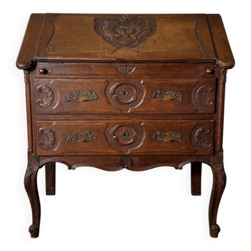 Antique solid wood secretary richly carved, in the Louis XV style.