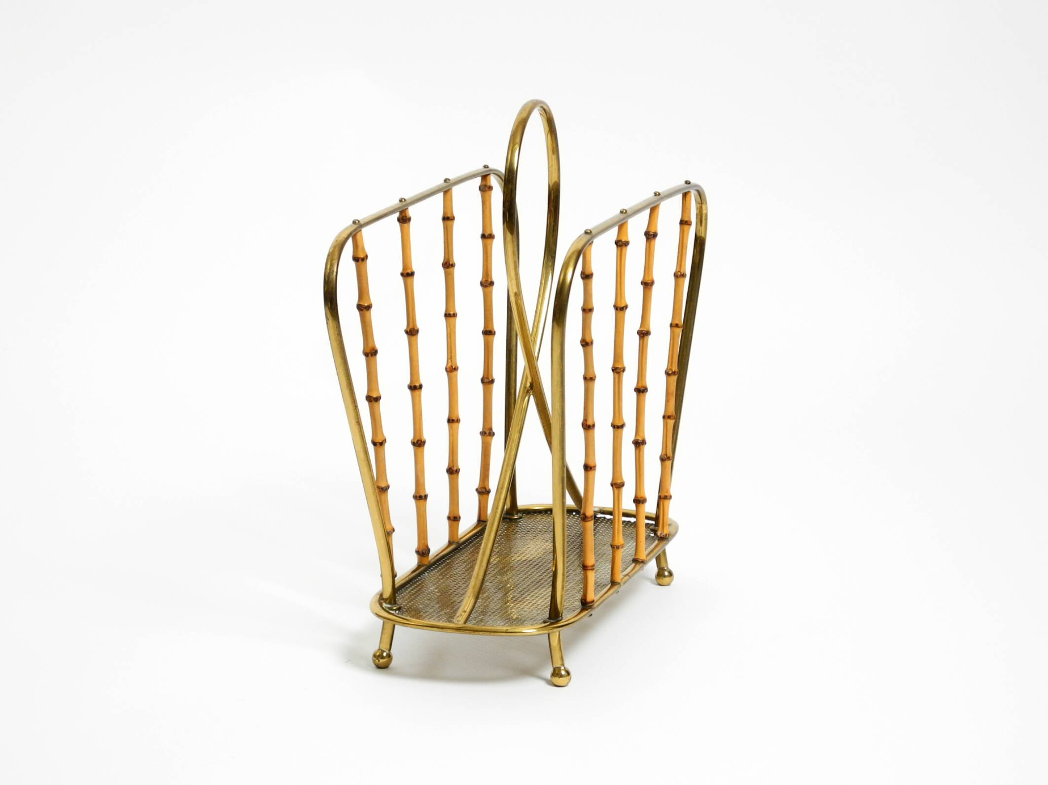 Rare Mid Century Modern magazine rack made of solid brass and genuine bambo