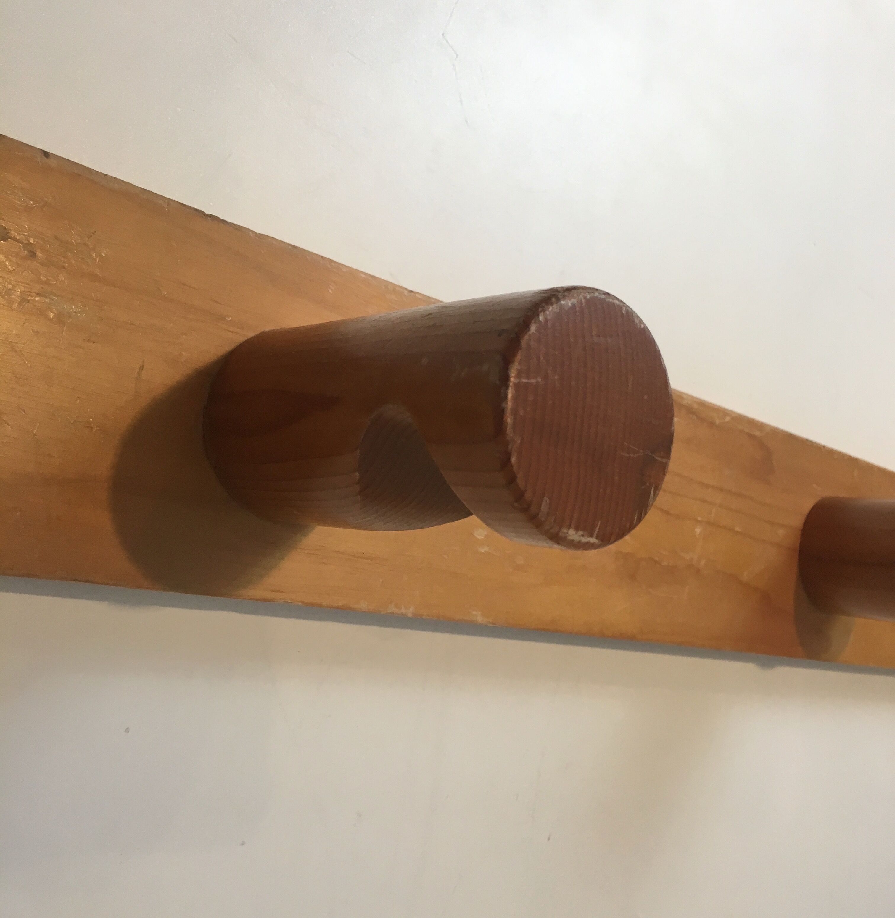 Charlotte Perriand, pair of fir wall coat racks, French work, around 1970
