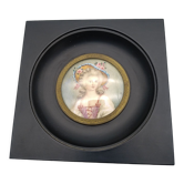 Miniature on ivory. Young woman with a flowery hat