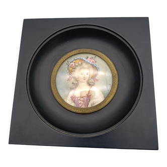 Miniature on ivory. Young woman with a flowery hat