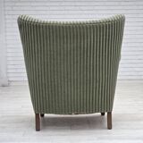 Fauteuil danois des années 1960, revêtement en velours vert, pieds en chêne.