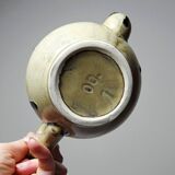 A pair of small vintage teapots in the Art Deco style reminiscent of Denbac.