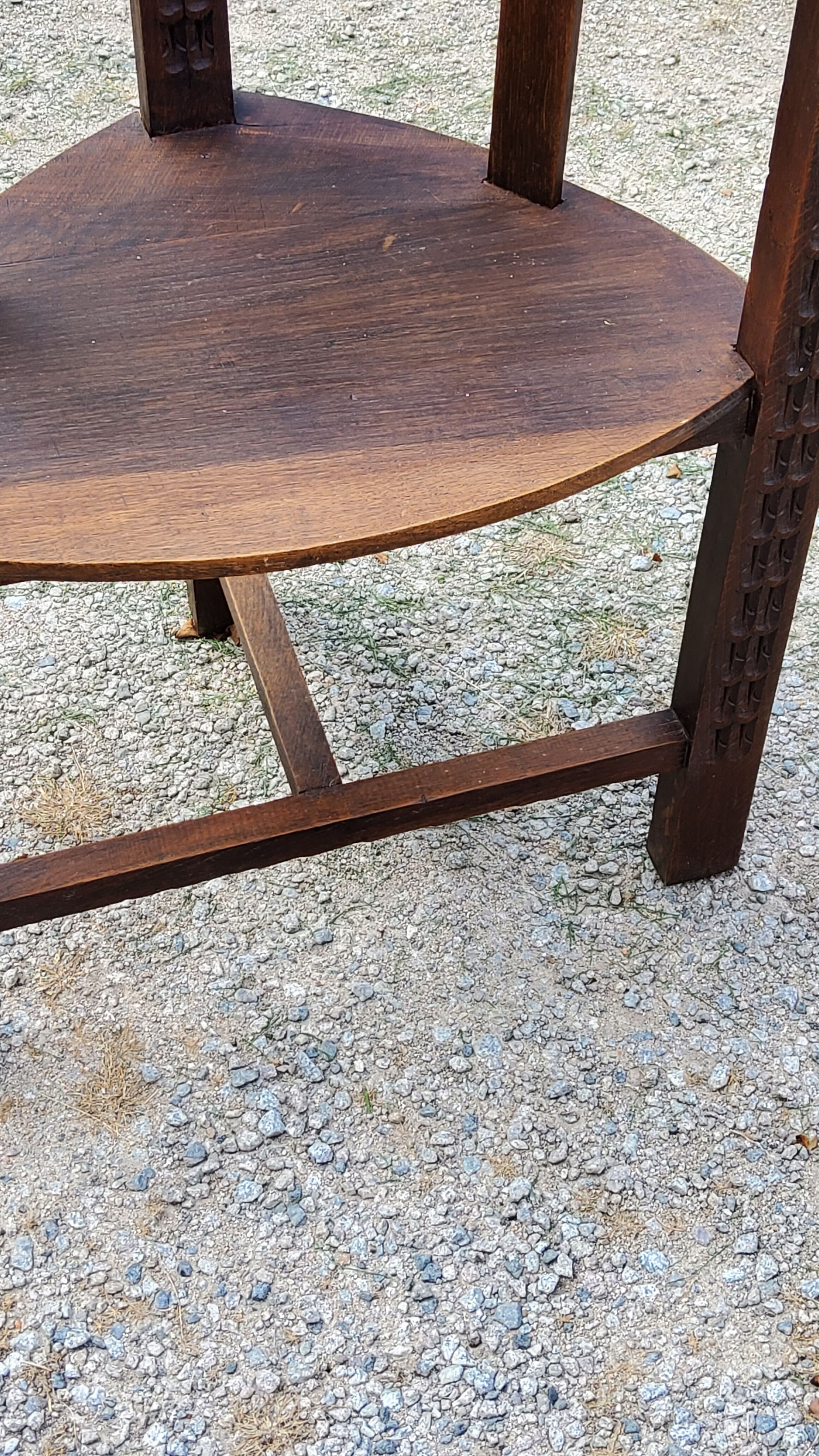 Set of three brutalist tripod armchairs in carved solid oak