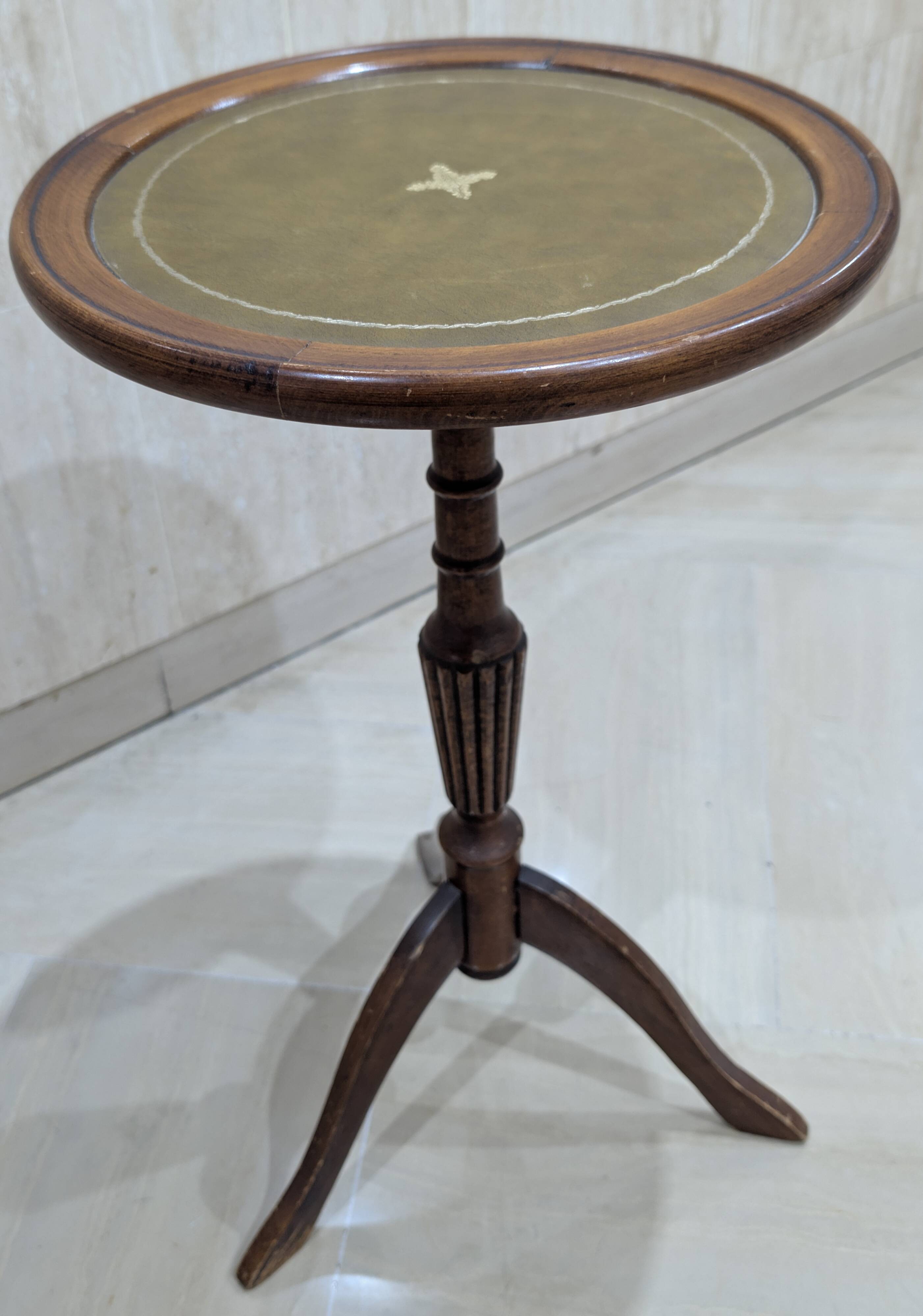 English style gueridon in wood – top covered with green/gold leather
