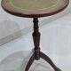 English style gueridon in wood – top covered with green/gold leather