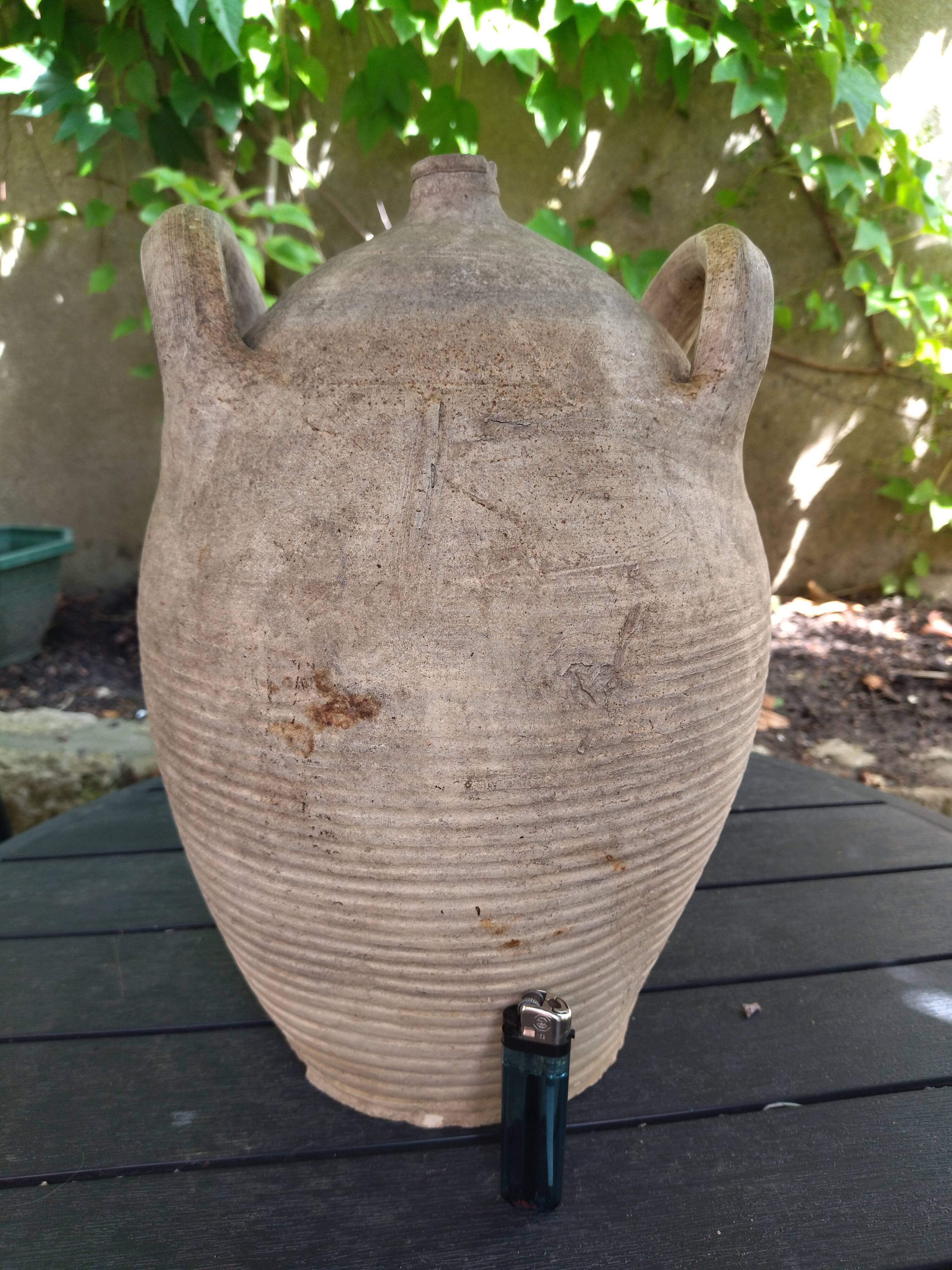 Ancient sandstone jar with two handles