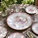 Round antique plate made of pink ironstone, signed Sarreguemines, Fontanges collection.